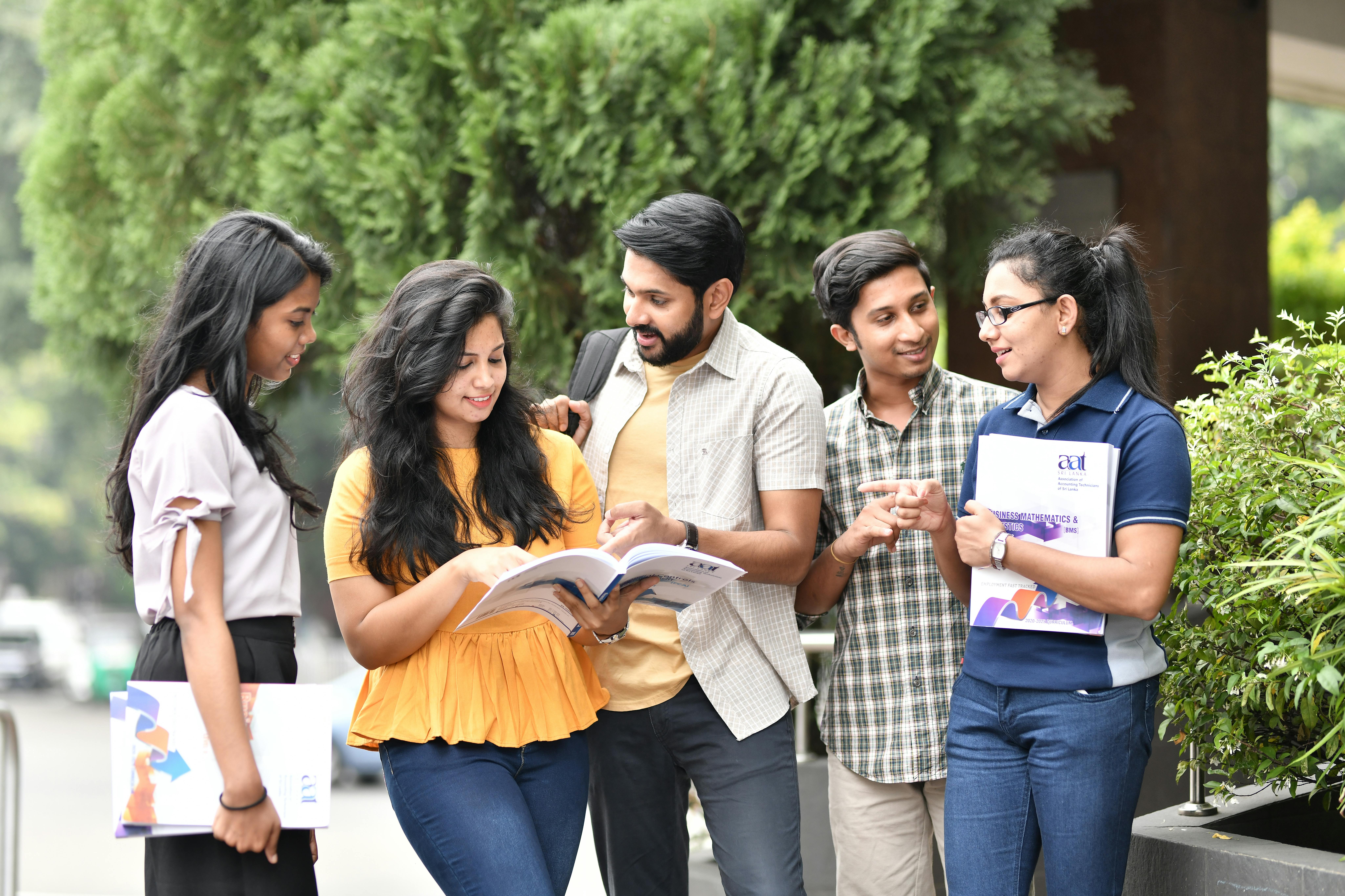 Students talking | Source: Pexels