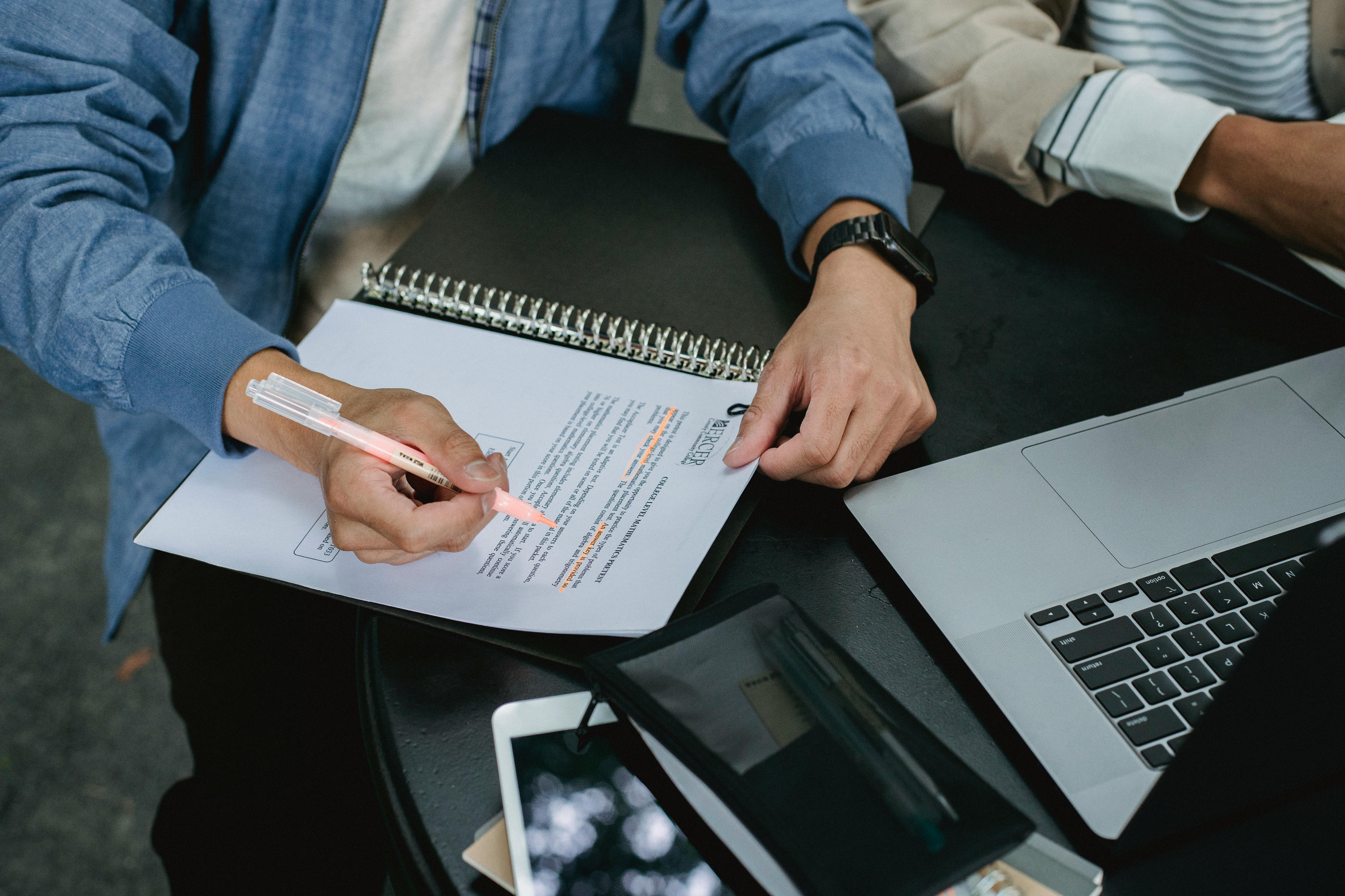Person checking documents | Source: Pexels
