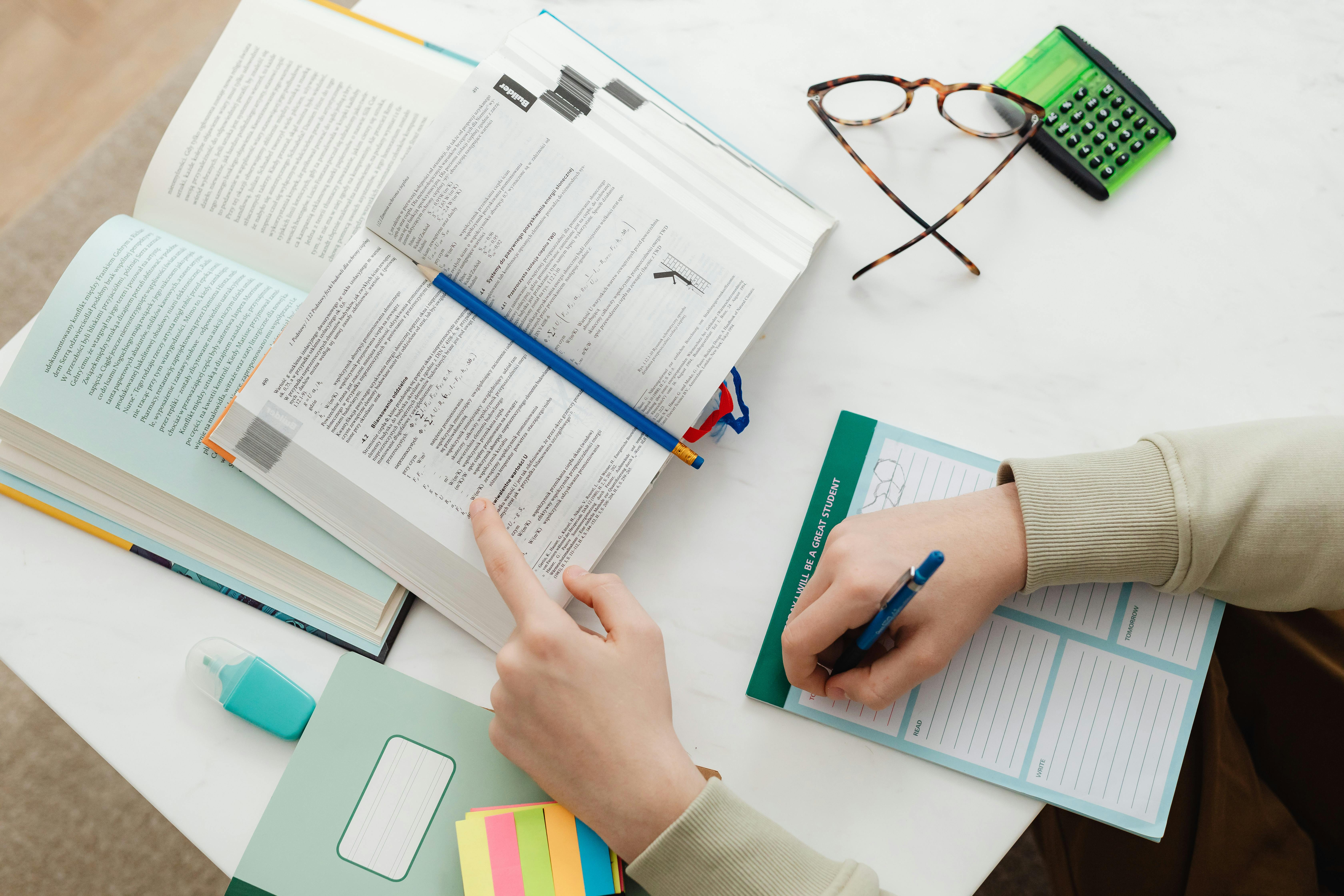 Person writing | Source: Pexels