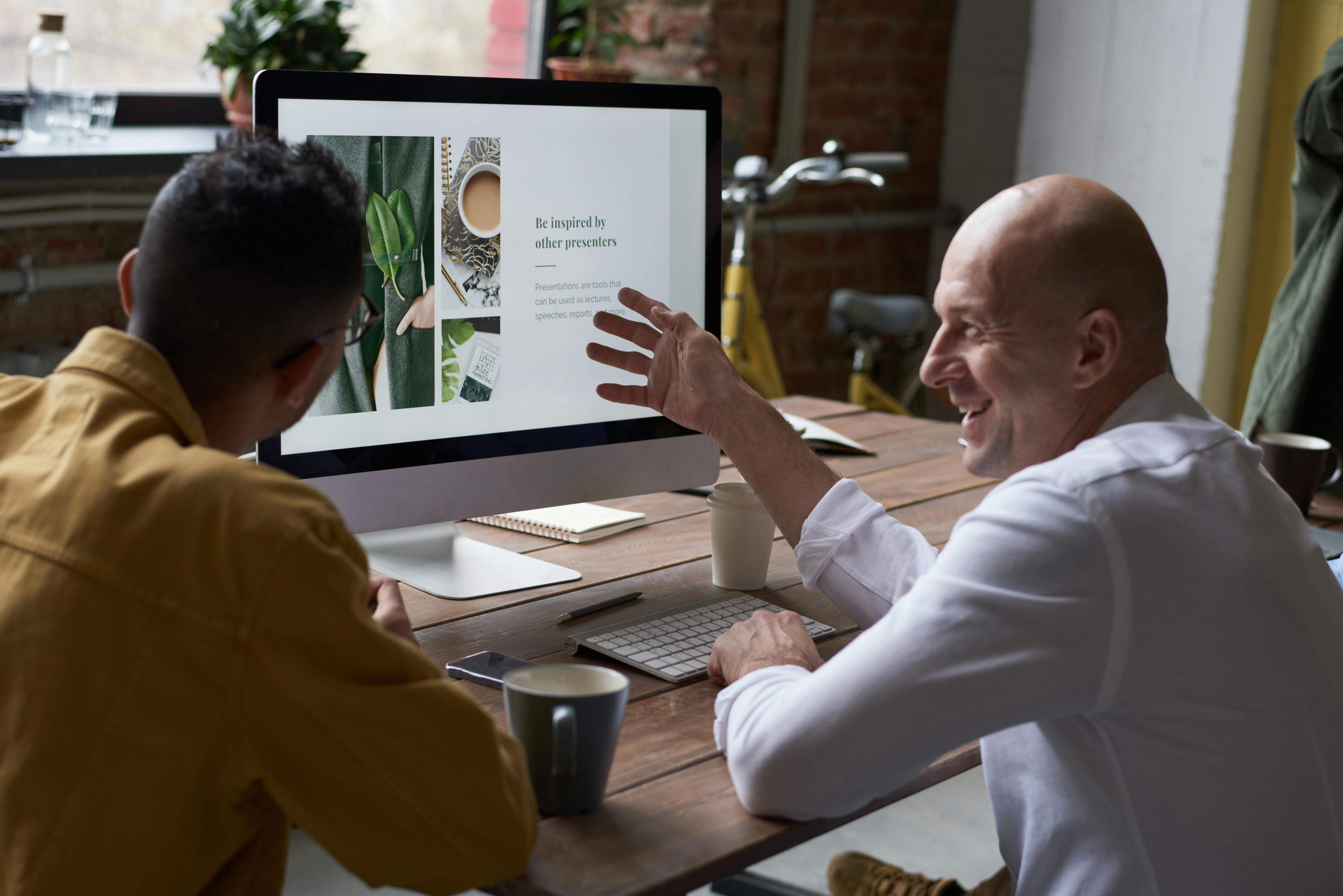 People looking at a computer screen | Source: Pexels