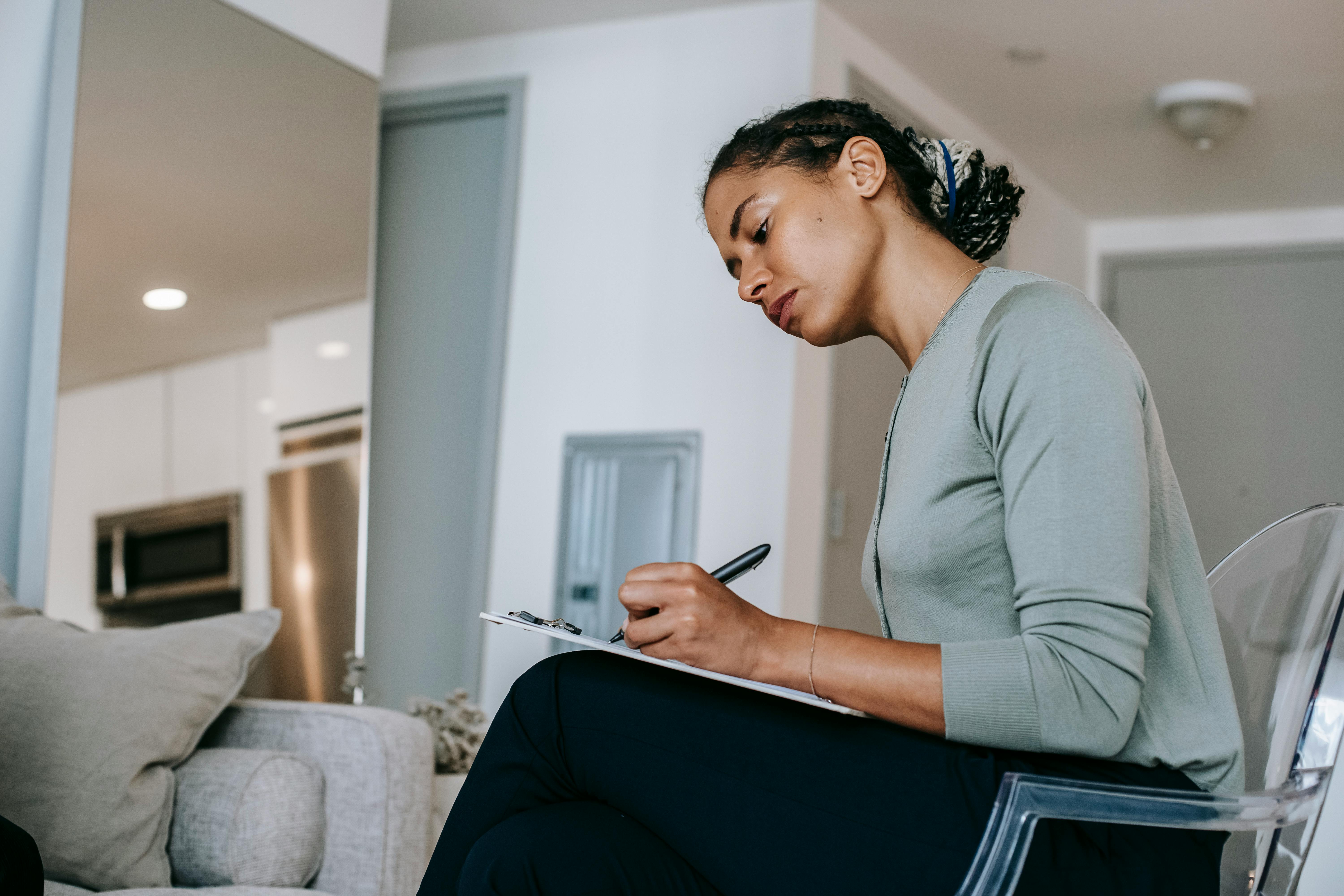 Woman writing | Source: Pexels