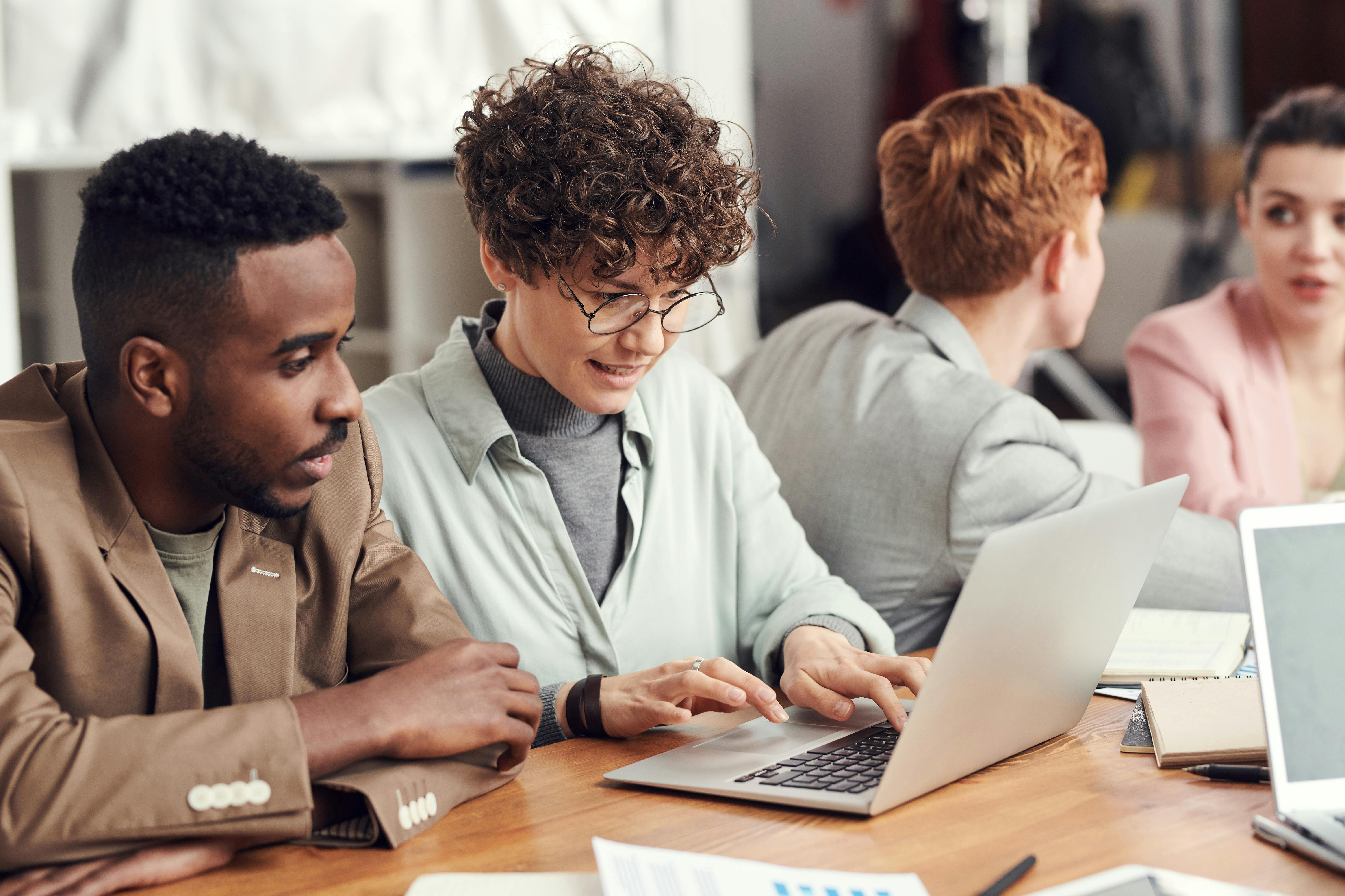 Students with laptops | Source: Pexels