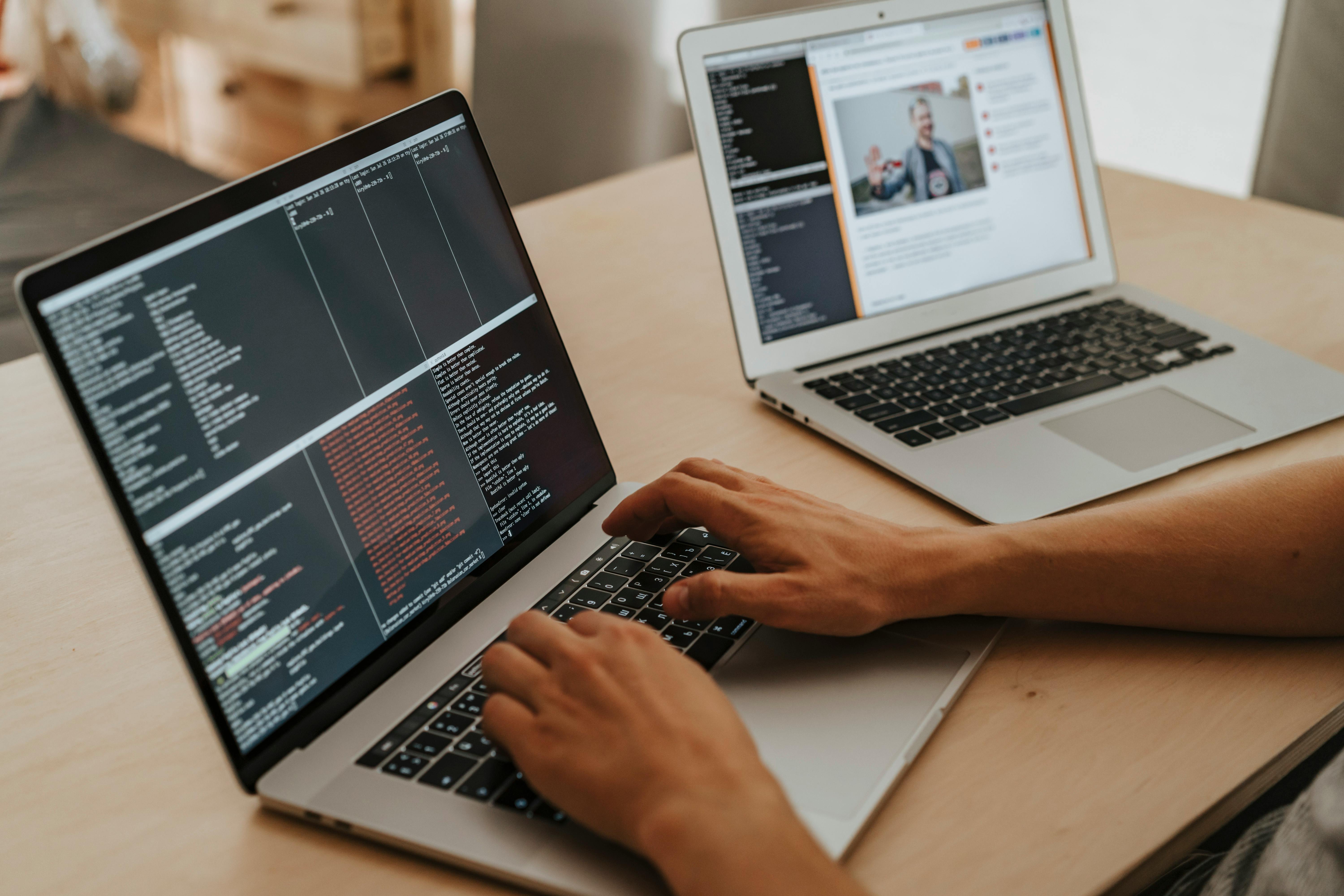 Two laptops on a desk | Source: Pexels