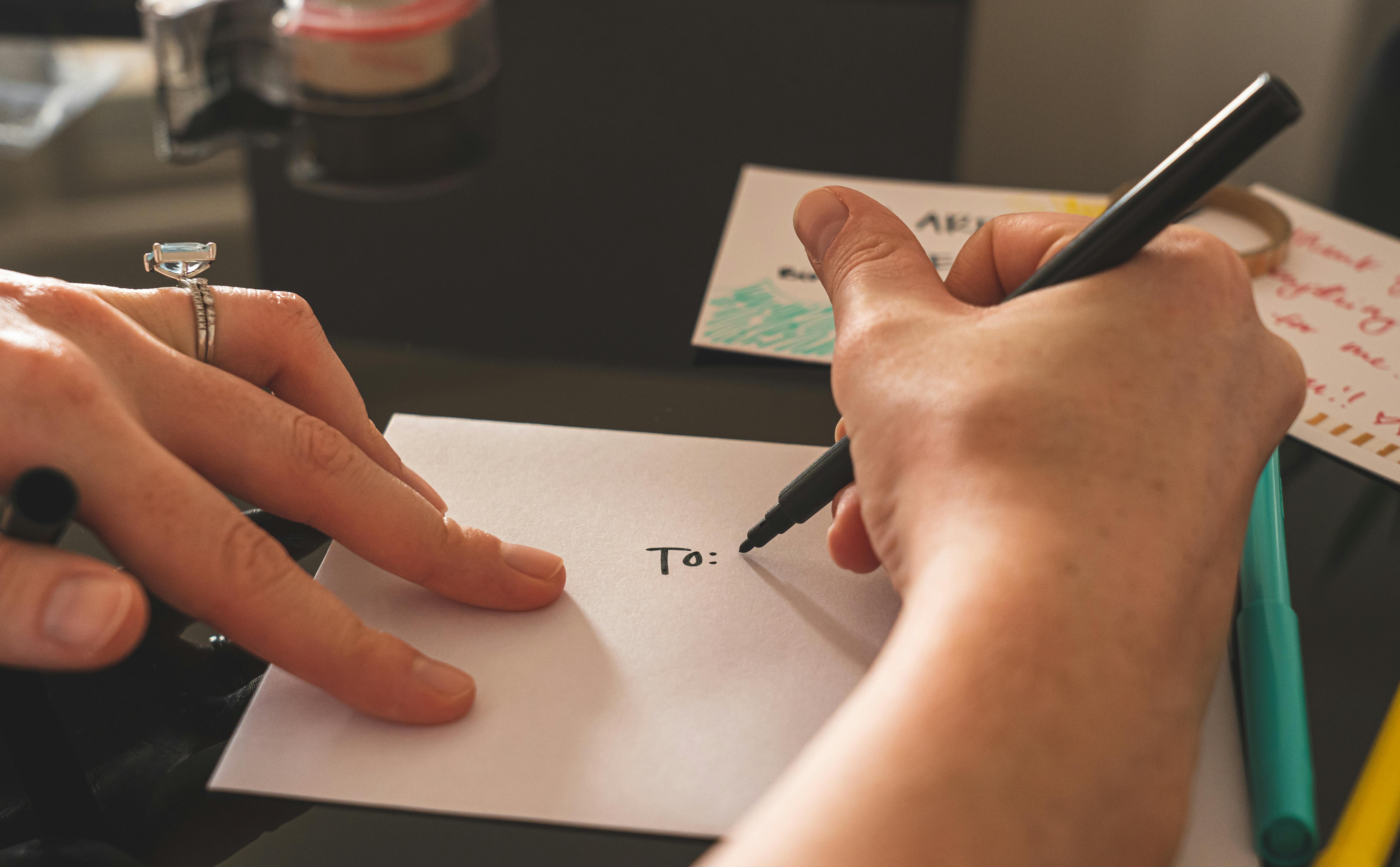 Person writing | Source: Pexels